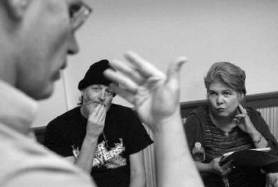 
Residents John Marshall and Sandy Stanaland listen to Tom Tremaine of the Northwest Justice Project, after a meeting of Commercial Building residents to discuss relocation efforts after BlueRay Technologies Inc. has purchased the building to produce Blu-ray discs. 
 (Dan Pelle / The Spokesman-Review)
