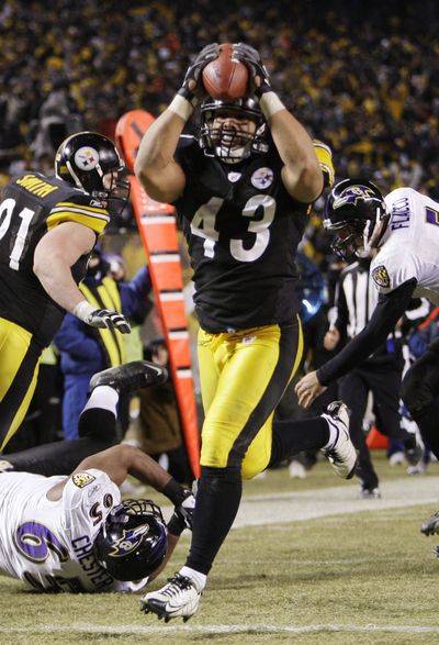 Steelers safety Troy Polamalu crosses the goal line on a 40-yard interception return for a touchdown that essentially sealed Pittsburgh’s win over Baltimore. (Associated Press / The Spokesman-Review)