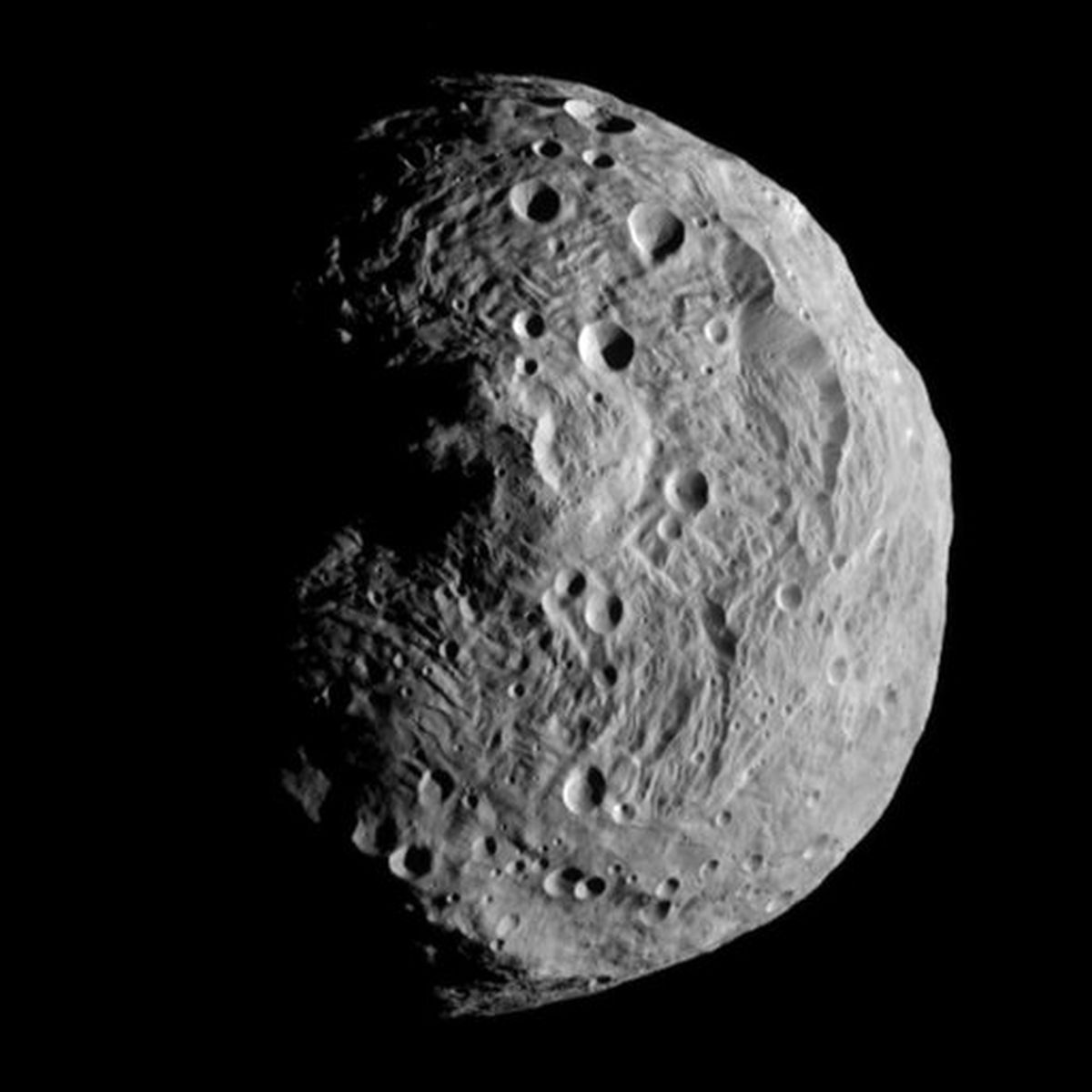 This image of the asteroid Vesta was taken by the Dawn spacecraft on Sunday from a distance of about 9,500 miles away. (Associated Press)