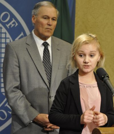 OLYMPIA – Courtney Anderson, of the Spokane Valley, explains how the Affordable Care Act allowed her to have the insurance that covered her cancer treatment during a press conference with Gov. Jay Inslee on Feb. 20, 2017. (Jim Camden / The Spokesman-Review)