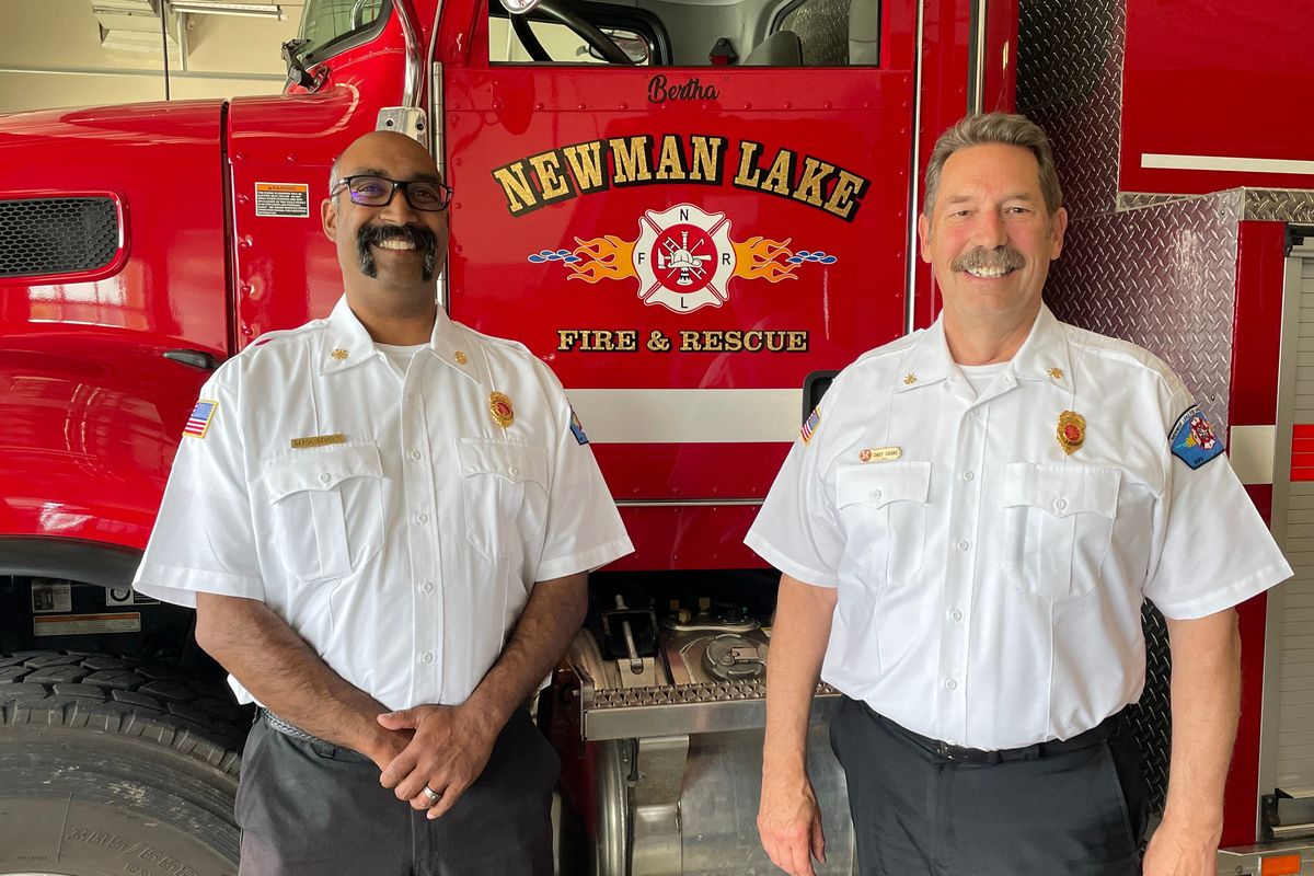 New Newman Lake Fire Chief Daron Bement, left, stands with former chief Stan Cooke.  (Nina Culver/For The Spokesman-Review)