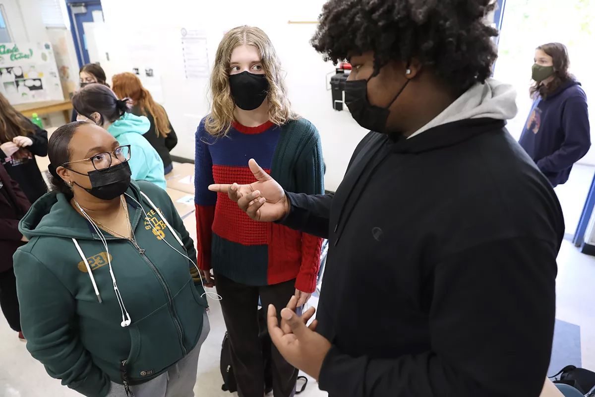 From left, Talaya Poindexter, Abigail Cregor and Mason Merriwether discuss topics in their ethnic studies class at Culver City High School in Culver City, Calif., in October 2021. On Feb. 1, the College Board released details of its first Advanced Placement class on African American studies for high school students.  (Christina House)