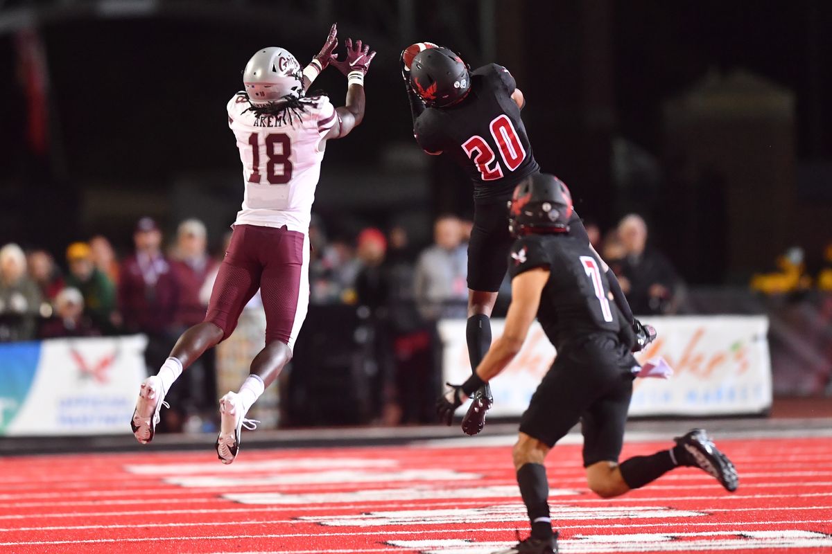Eastern Washington Eagles defensive back Marlon Jones Jr. (20) intercepts a pass intended for Montana Grizzlies wide receiver Samuel Akem (18) during the second half of a college football game on Oct. 2 at Roos Field in Cheney. EWU won the game 34-28.  (Tyler Tjomsland/The Spokesman-Review)