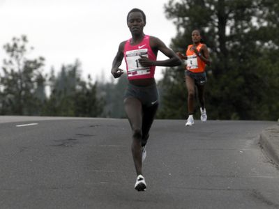 Bloomsday winner Lineth Chepkurui of Kenya put some distance between her and Teyba Erkesso of Ethiopia on Government Way.  (J. Bart Rayniak / The Spokesman-Review)
