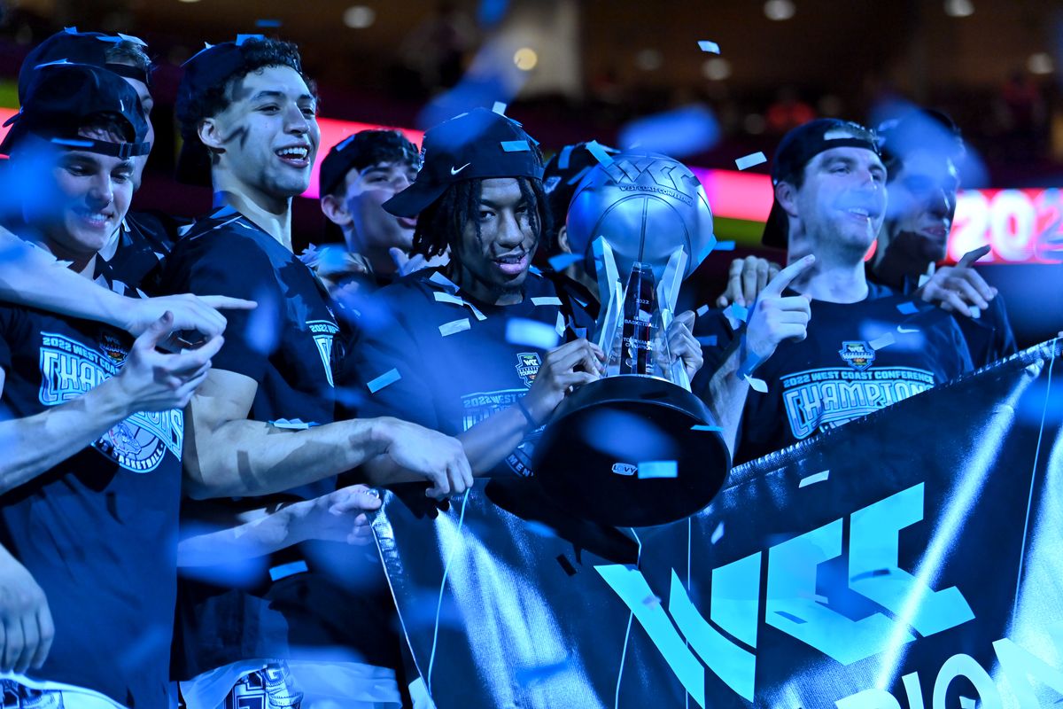 Gonzaga is bathed in blue light and showered in confetti as Gonzaga Bulldogs guard Hunter Sallis (10) holds the WCC championship trophy following GU’s defeat of the St. Mary