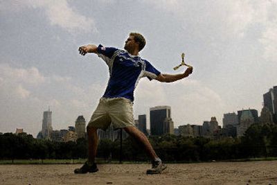 
Wilson Lawrence of Stamford, Conn., demonstrates boomerang throwing technique near Sheep's Meadow at Central Park on Wednesday in New York.
 (Associated Press / The Spokesman-Review)