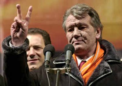
Opposition leader Viktor Yushchenko shows a V-sign during an opposition rally Wednesday in Kiev.
 (Associated Press / The Spokesman-Review)
