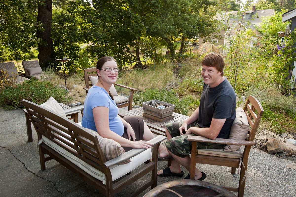 In an effort to reduce watering, Aaron and Kristi Theisen planted their yard with native plants. (Colin Mulvany)