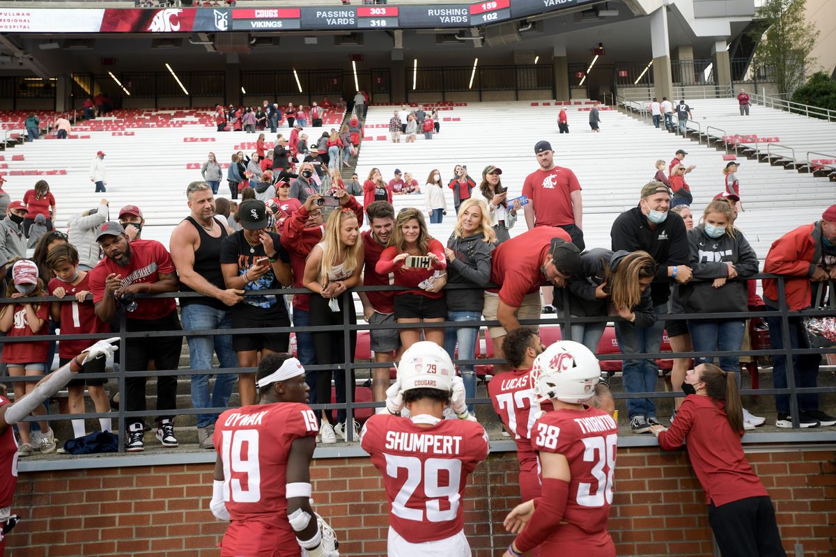 WSU players visit with fans after the second half of a college football game against the Portland State Vikings on Saturday, Sep 11, 2021, at Martin Stadium in Pullman, Wash. WSU won the game 44-24.  (Tyler Tjomsland/The Spokesman-Review)