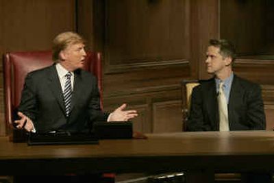 
In this photo released by NBC, Donald Trump, left appears with software executive Kelly Perdew, 37, on stage Thursday in New York for the season finale of NBC's 