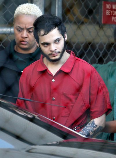 In this Jan. 30, 2017  photo Esteban Santiago is escorted from the Broward County jail for an arraignment in federal court in Fort Lauderdale, Fla. (Lynne Sladky / Associated Press)