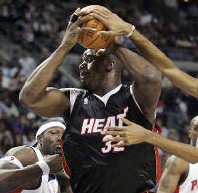 
The Heat, behind Shaquille O'Neal (32), try for their 15th straight win tonight versus Seattle. 
 (Associated Press / The Spokesman-Review)