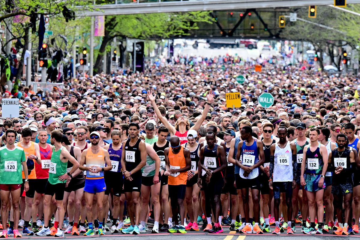 Runners check their watches and say their prayers before the start of last year’s Bloomsday on May 7.  (Tyler Tjomsland/The Spokesman-Review)
