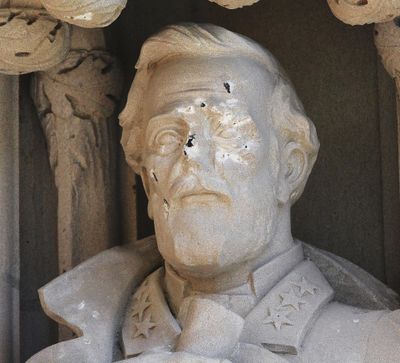 In this Aug. 17, 2017, photo, the defaced Gen. Robert E. Lee statue stands at the Duke Chapel on Thursday, Aug. 17 2017, in Durham, N.C. (Bernard Thomas / Associated Press)