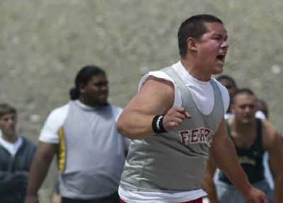 
Eventual champion Cameron Elisara of Ferris lets out a shout during Saturday's State 4A shotput competition in Pasco.
 (Molly Van Wagner Special to / The Spokesman-Review)