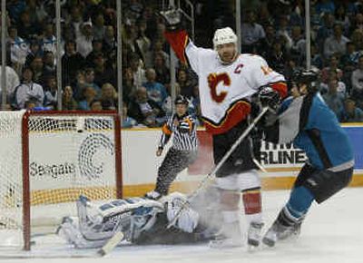 Calgary's Jarome Iginla (12) celebrates after swatting a first-period goal past San Jose goalie Evgeni Nabokov, left, and defenseman Brad Stuart in Game 5 action Monday night. Calgary's Jarome Iginla (12) celebrates after swatting a first-period goal past San Jose goalie Evgeni Nabokov, left, and defenseman Brad Stuart in Game 5 action Monday night.
(Associated PressAssociated Press / The Spokesman-Review)