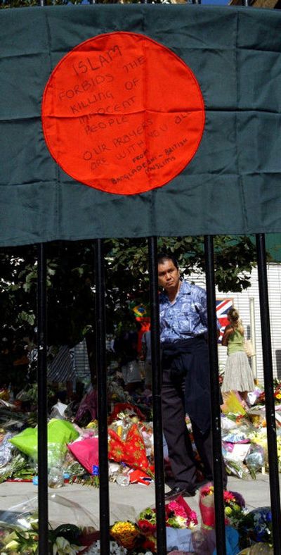 
A flag with a message from Bangladeshi-British Muslims hangs in London as people pay their tributes Wednesday to those killed in last week's attacks.
 (Associated Press / The Spokesman-Review)