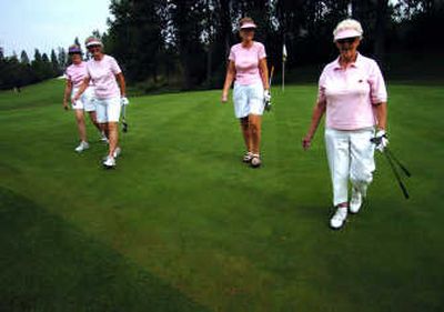 
Carol Pupo, left to right, Virginia Jacobson, Diane Strobel, and Ann Babcock walk off the eighth  green at Downriver Golf Course.  