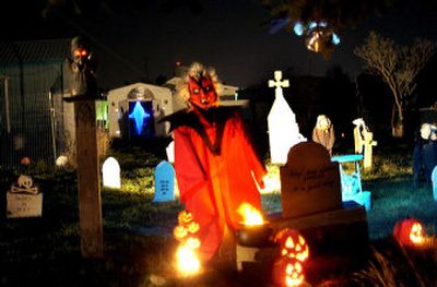 
Wilson's yard  is transformed into a graveyard complete with monsters, ghosts and ghouls. On Halloween night trick-or-treaters are welcome  to wander through the graveyard. 
 (The Spokesman-Review)