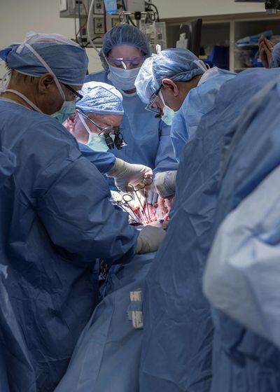 A team of Cleveland Clinic transplant surgeons and gynecological surgeons perform the nation’s first uterus transplant Wednesday during a nine-hour surgery. (Associated Press)