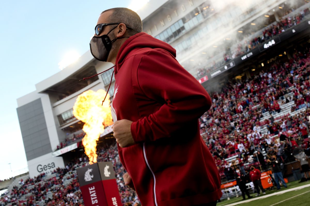 Washington State Cougars head coach Nick Rolovich heads to the field before the start of the first half of a college football game on Saturday, Oct 16, 2021, on Gesa Field in Martin Stadium in Pullman, Wash. WSU won the game 34-31.  (Tyler Tjomsland/The Spokesman-Review)