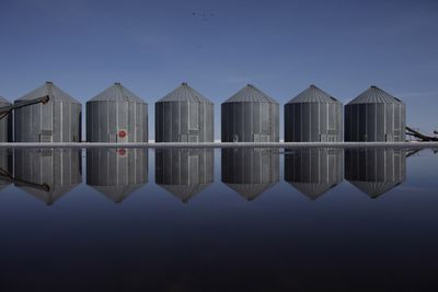 Grain silos are reflected in floodwater Sunday  in Halstad, Minn., about 35 miles north of Fargo, N.D.  (Associated Press / The Spokesman-Review)