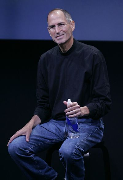 In this Oct. 14 file photo, Apple Inc. CEO Steve Jobs smiles during a product announcement at Apple headquarters in Cupertino, Calif. Jobs on Wednesday said he is taking a medical leave of absence until the end of June.  (FILE Associated Press / The Spokesman-Review)