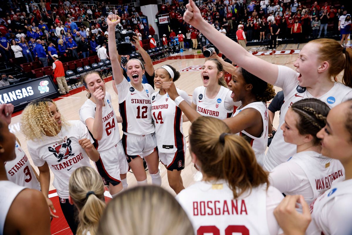 Stanford’s Lexie Hull (12), a Central Valley High graduate, celebrates with teammates after the Cardinal defeated Kansas in a second-round game of the women’s NCAA Tournament on Sunday in Stanford, Calif. (Associated Press)