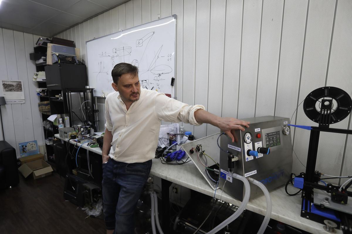 Tomas Kapler, an IT expert, talks about a lung ventilator "Corovent" in Prague, Czech Republic, Monday, June 15, 2020. A group of volunteers in the Czech Republic was working round the clock to prevent critical shortage of ventilators for COVID-19 patients. Led by Tomas Kapler, a team of 30 developed a fully functional ventilator _ named Corovent _ in just days. They secured the necessary finances through crowdfunding, approached a leading expert in the field with a request for help and gave him all possible support.  (Petr David Josek)