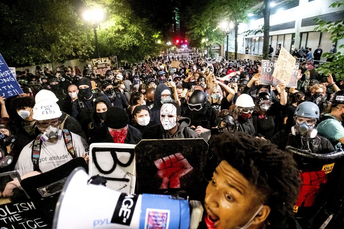Black Lives Matter protesters march through Portland on Sunday after rallying at the Mark O. Hatfield United States Courthouse. (Noah Berger)