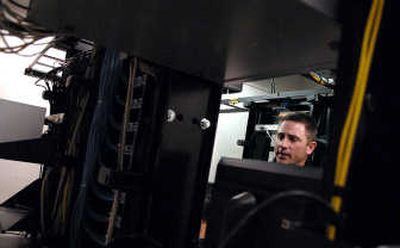 
Lt. Pat Knight of the Post Falls Police Department talks about the development of the Internet Crimes Against Children program while in the computer forensic lab. 
 (Kathy Plonka / The Spokesman-Review)