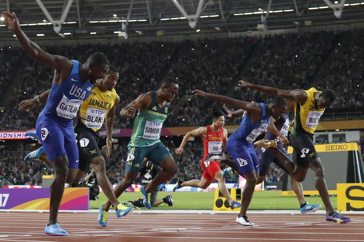 United States’ Justin Gatlin, left, crosses the line to win gold ahead of silver medal winner United States’ Christian Coleman, second right, and bronze medal winner Jamaica’s Usain Bolt, right, in the men’s 100m final during the World Athletics Championships in London Saturday, Aug. 5, 2017. (Matt Dunham / Associated Press)