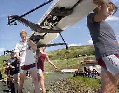 
Jody Thomas, center, Liz Rand, right, and their WSU teammates prepare for Saturday's race against Stanford on the Snake River. 
 (Joe Barrentine / The Spokesman-Review)