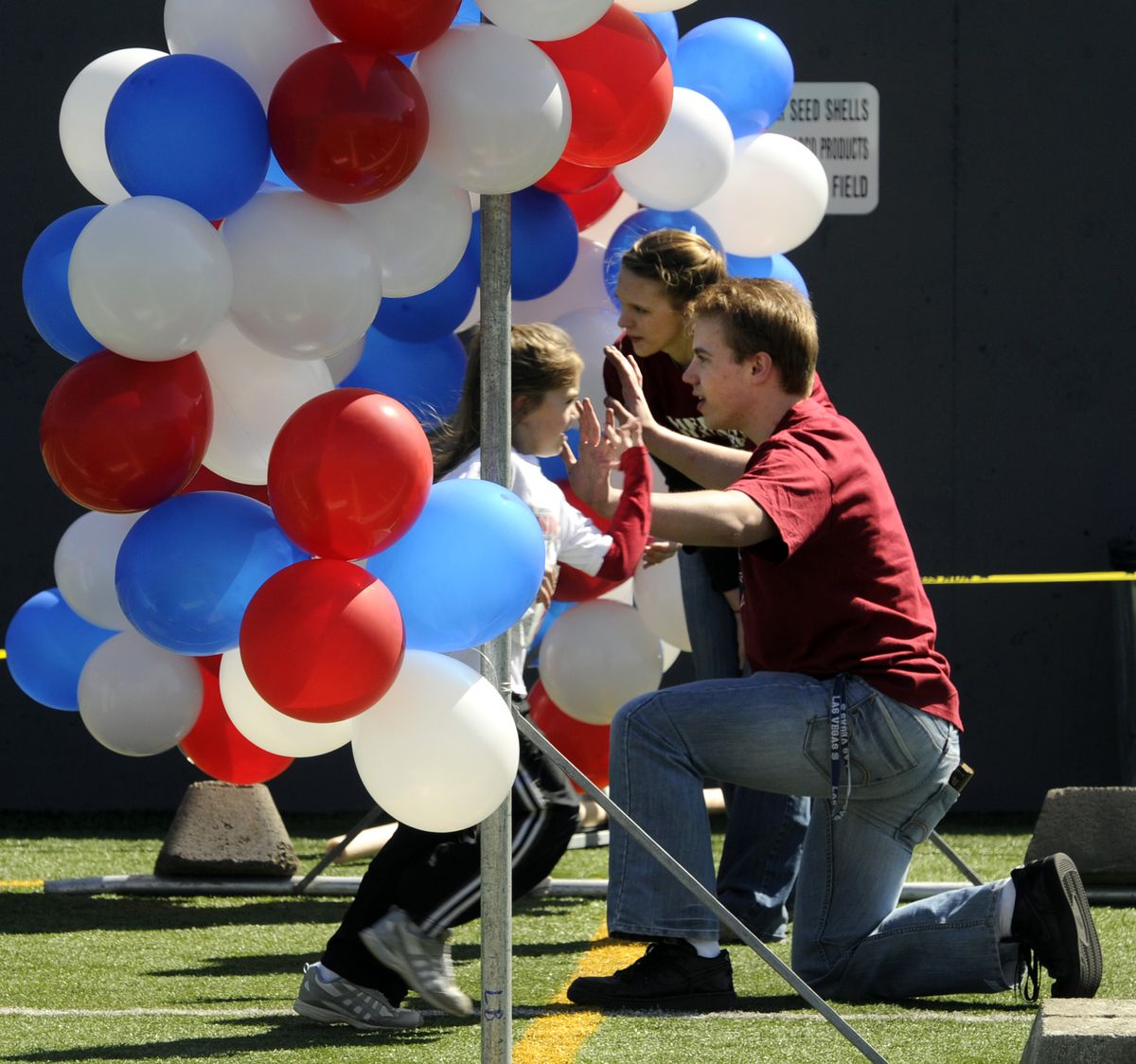 Finishers are welcomed home during  the 2010 America's Kids Run, April 24, in Spokane, Wa.  After 25 years the event held its last race on Saturday at Joe Albi Stadium. (Dan Pelle / The Spokesman-Review)