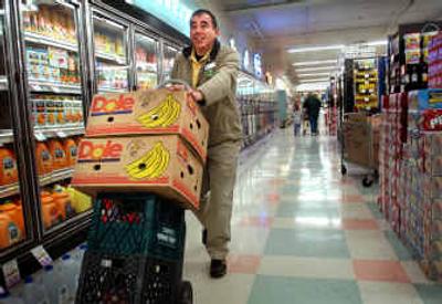 
Second Harvest driver Angelo Chavez picks up donated perishable foods at the Rosauers on 14th Avenue. 
 (Holly Pickett / The Spokesman-Review)