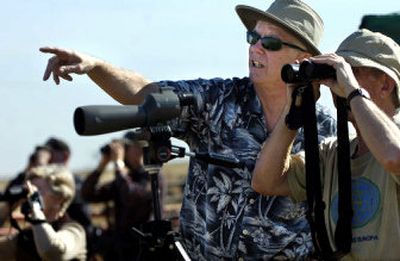 
Spokane Audubon Society member Dave Plemons points out waterfowl to Inland Northwest Land Trust member John Douglas on Saturday.
 (Photos by Holly Pickett / The Spokesman-Review)