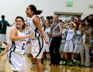 Northwest Christian girls celebrate their 33-32 win over Colfax, Friday, Jan. 24, 2014, at Northwest Christian School. (Colin Mulvany / The Spokesman-Review)