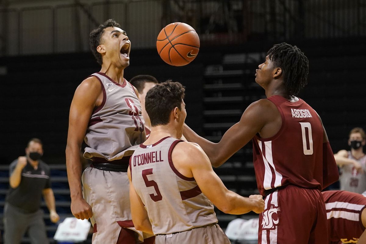 Stanford’s Oscar da Silva, left, who scored 27 points, celebrates after scoring and being fouled by Washington State on Saturday.  (Associated Press)