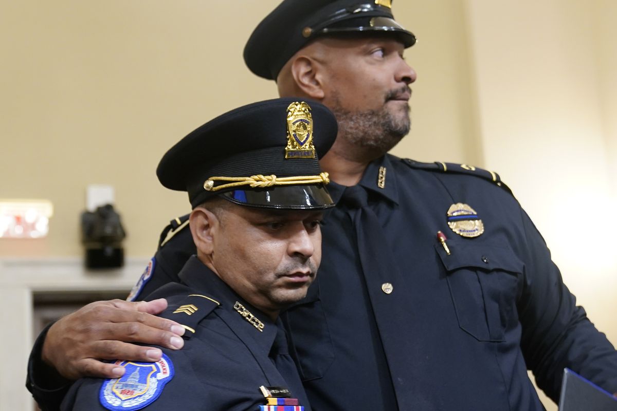 U.S. Capitol Police Sgt. Aquilino Gonell left, and U.S. Capitol Police Sgt. Harry Dunn stand after the House select committee hearing on the Jan. 6 attack on Capitol Hill in Washington, Tuesday, July 27, 2021.  (Andrew Harnik)