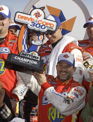 Tony Stewart celebrates another Nationwide win at Daytona on Saturday. (Associated Press)
