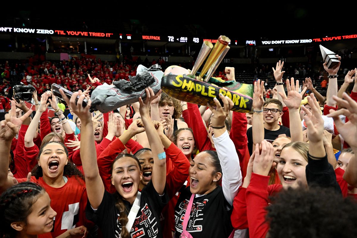 The North Central Wolfpack celebrate winning the Groovy Shoes spirit competition during the Groovy Shoes high school basketball game with Shadle , Tuesday, Jan. 9, 2024, in the Spokane Arena.  (Colin Mulvany/The Spokesman-Review)