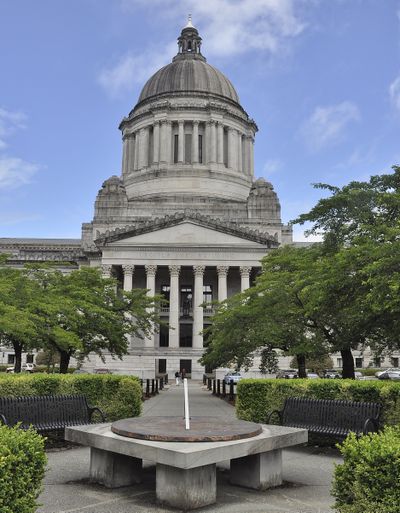 OLYMPIA -- A sundial and benches form a meeting place between the House and Senate offices at the south entrance to the domed Legislative Building. (Jim Camden/The Spokesman-Review)