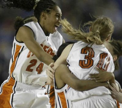 
Lewis and Clark's Brittany Kennedy, left, and Lyndi Seidensticker celebrate after their quarterfinal win.
 (Jim Bryant Special to / The Spokesman-Review)