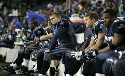 
The expressions on punter Ryan Plackemeier, center, and his Seahawks teammates tell the story Thursday night. 
 (Associated Press / The Spokesman-Review)
