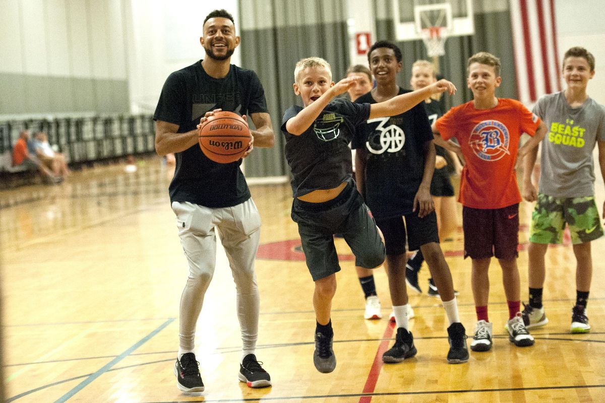 Former Gonzaga star Nigel Williams-Goss watches Lincoln Jent,12, take a shot during his annual basketball camp at The Hub in Liberty Lake on Tuesday, August 6, 2019. (Kathy Plonka / The Spokesman-Review)