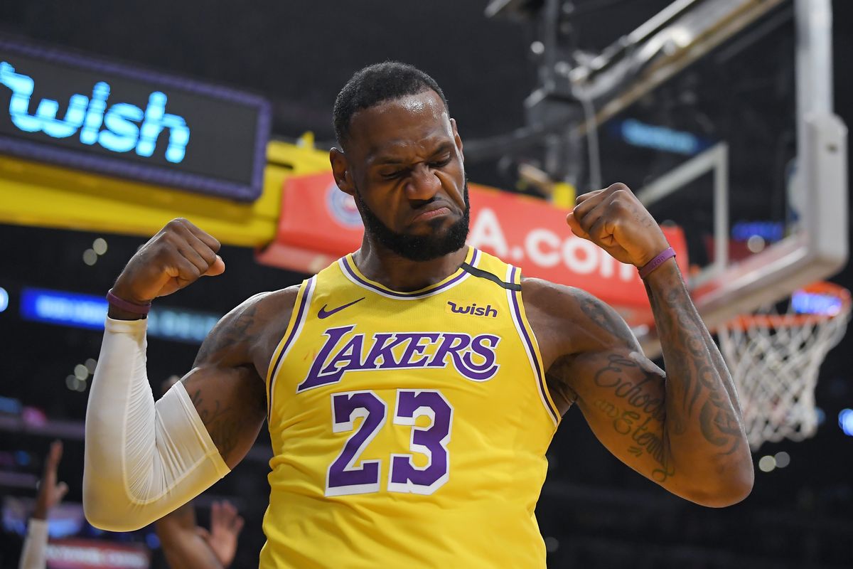 Los Angeles Lakers forward LeBron James gestures after scoring and drawing a foul during the first half of an NBA game against the New York Knicks on Jan. 7 in Los Angeles. James was announced as the winner of The Associated Press’ Male Athlete of the Year award for a record-tying fourth time on Saturday.  (Associated Press)