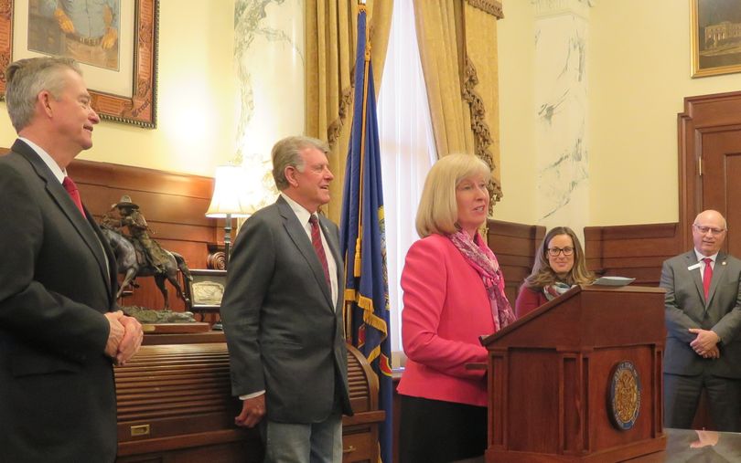 Sen. Mary Souza, R-Coeur d'Alene, speaks at a ceremony in Idaho Gov. Butch Otter's office on Wednesday, March 28, 2018, celebrating new youth suicide prevention training legisation. At left is Lt. Gov. Brad Little; at center, Otter; and at right, Shannon Decker of the Idaho Suicide Prevention Coalition and Sen. Fred Martin, R-Boise. (The Spokesman-Review / Betsy Z. Russell)