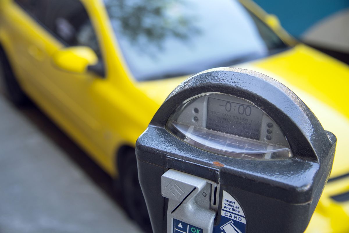 Time on a downtown Spokane parking meter has expired for a Chevy parked on Riverside Avenue, June 5. (Dan Pelle / The Spokesman-Review)