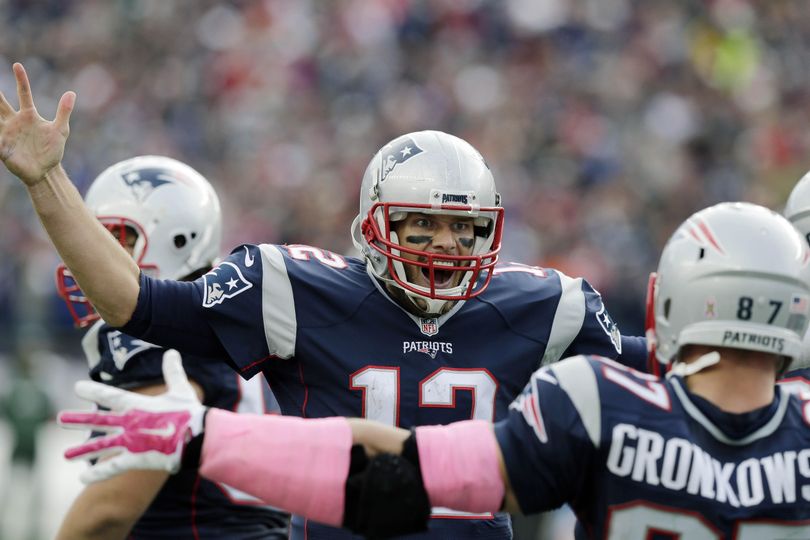 New England Patriots quarterback Tom Brady (12) celebrates his touchdown pass to tight end Rob Gronkowski (87) during the second half of an NFL football game, Sunday, Oct. 25, 2015, in Foxborough, Mass. (Charles Krupa / Associated Press)