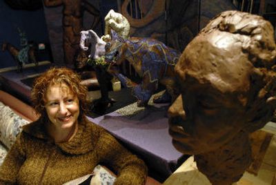 
Artist Rhea Giffin sits with some of her serious and whimsical creations at her studio in Coeur d'Alene. 
 (Jesse Tinsley / The Spokesman-Review)